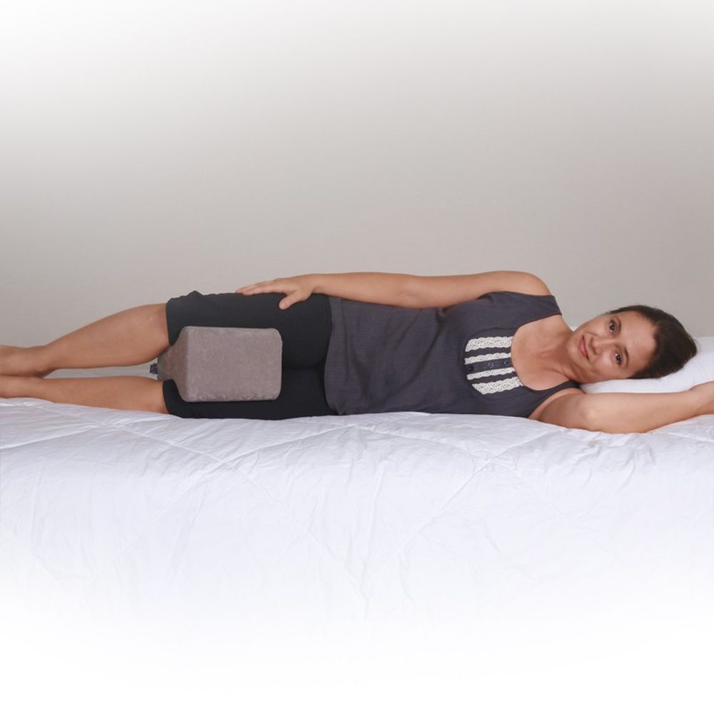 Person using a Leg Spacer Positioning Pillow
