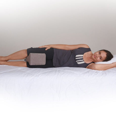 Person using a Leg Spacer Positioning Pillow
